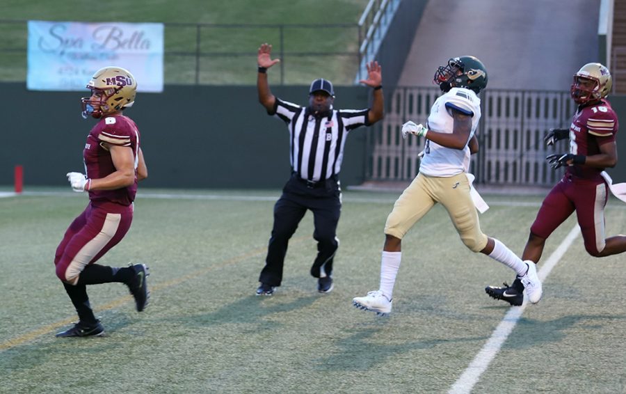 Bryce Martinez, criminal justice sophomore and wide receiver, scores a touchdown at the first football game against Humboldt at Memorial Stadium on Sept. 1. Martinez scored two touchdowns during the game. Mustangs win by 43 points, 55-12. Photo by Justin Marquart