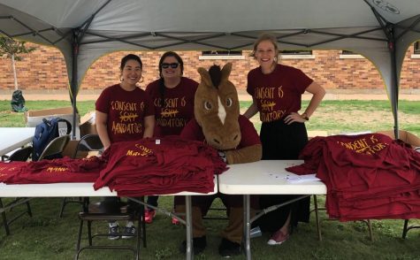 Maverick T. Mustang, mascot, and Counseling Center staff members gives out shirts for Consent Day at MSU #notonmycampusMSUTexas. Photo by Kristin Silva.