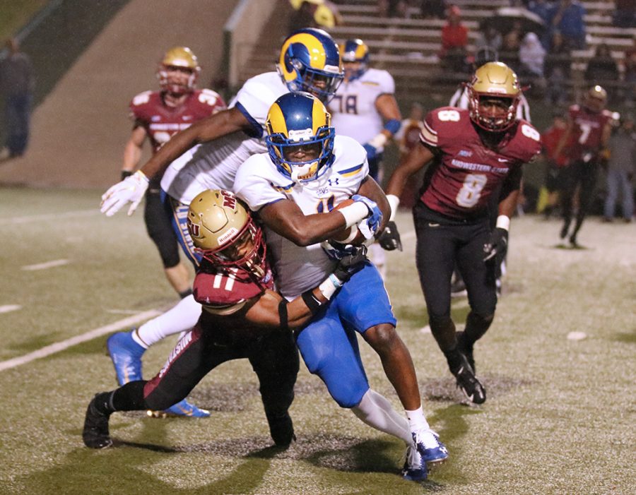 Computer science junior, Marcus Wilkerson takes down Angelo State University offensive player at game against Angelo State University. Sep 21. Photo by Brittni Vilandre