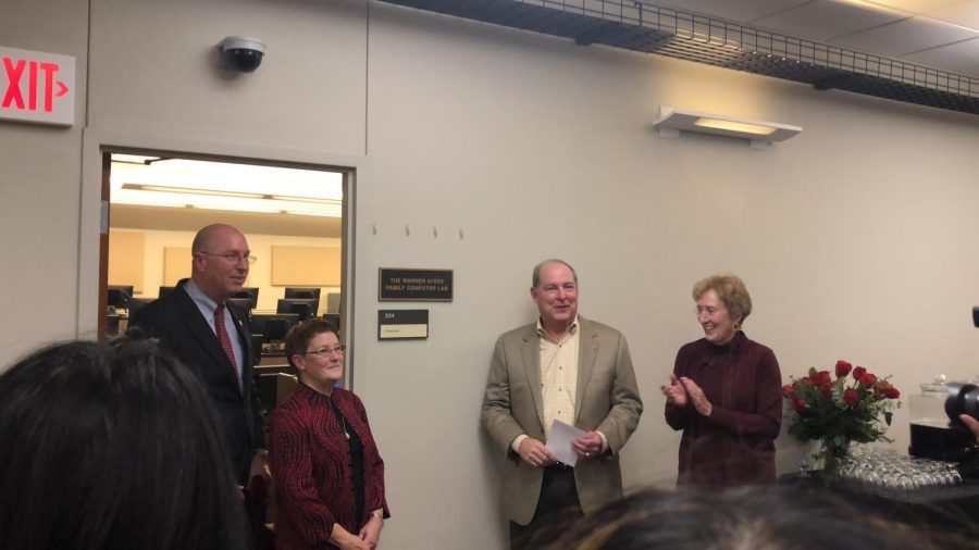 Warren and Pam Ayres, with the help of Jeff Stambaugh, unveiled the plaque at the Warren Ayres Family Computer Lab Dedication Ceremony on Oct. 18, 2018. Photo by Chloe Phillips