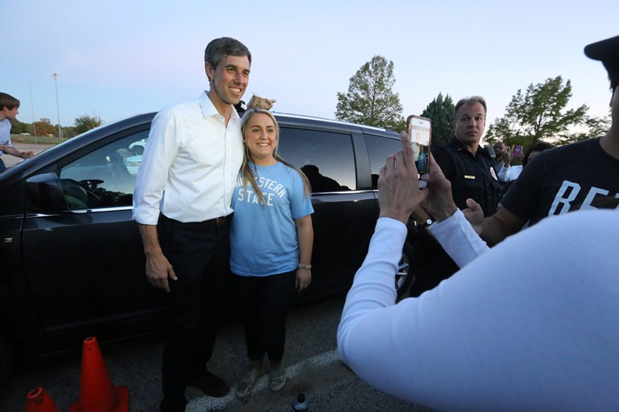 Tanner Roberts from Bowie, Texas poses with U.S. Senate candidate Beto ORourke at a rally in Kiwanas Park in Wichita Falls, Oct. Oct. 29, 2018. Roberts gave ORourke a guitar pick. Photo by Bradley Wilson