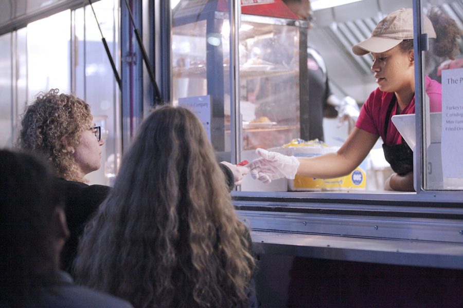 Students use tickets to get free food from the food truck at the MSU Texas Fair at Nocona Trail Oct.25.