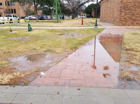 water covering sidewalk