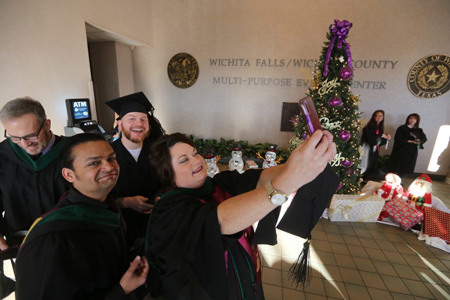 Amy Allen, a masters student in radiological sciences, takes a group selfie before gradauation at Midwestern State University graduation Dec. 15, 2018. Our class, all of us are extremely close, Allen said. Photo by Bradley Wilson