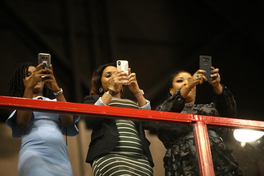 Cheering for Sharon Izedonmi, Nelly Nwosu, Lyn Shirley Murombo and Chiddy Ezeanyagu also take pictures at Midwestern State University graduation Dec. 15, 2018. Photo by Bradley Wilson