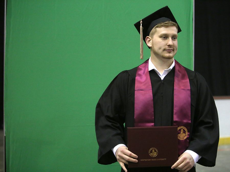 Cameron McEnturff, business administration, poses for his picture at Midwestern State University graduation Dec. 15, 2018. Photo by Bradley Wilson
