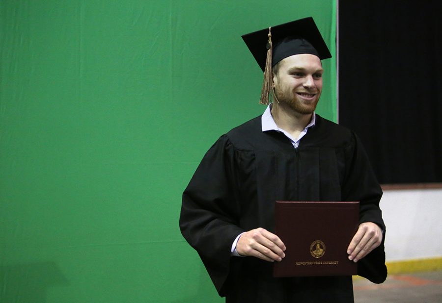 Alexander Mullet, business administration, poses for his portrait at Midwestern State University graduation Dec. 15, 2018. Photo by Bradley Wilson