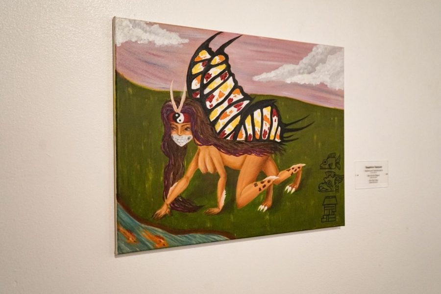 Art students Sapphire Vasquez and Sarah Grigeo display their art in the Juanita Harvey Art Gallery, Sept. 29. 