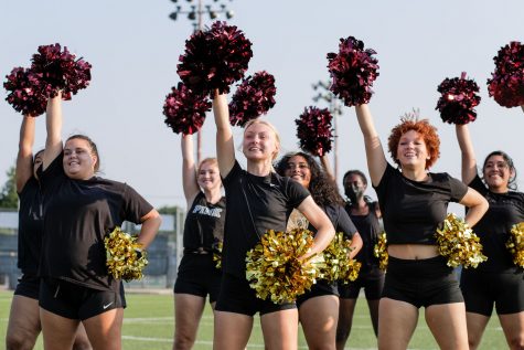 Social work senior Alicia Phinney leads the dance team during a practice