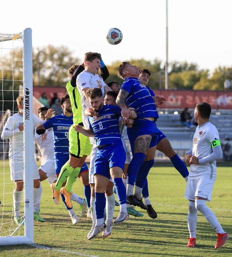 Masters of business administration senior and midfielder James Doyle and marketing senior, goalkeeper and teammate Marc-Antoine Huzen block a corner kick by St. Marys.