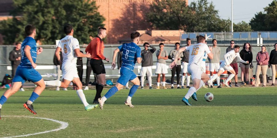 Masters of business administration senior and midfielder James Doyle dribbles the ball, rushing toward the opposing St. Marys goal