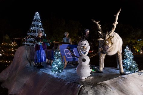 Characters from Disneys Frozen stand on a display and move to music from the film at the 2021 MSU Fantasy of Lights.