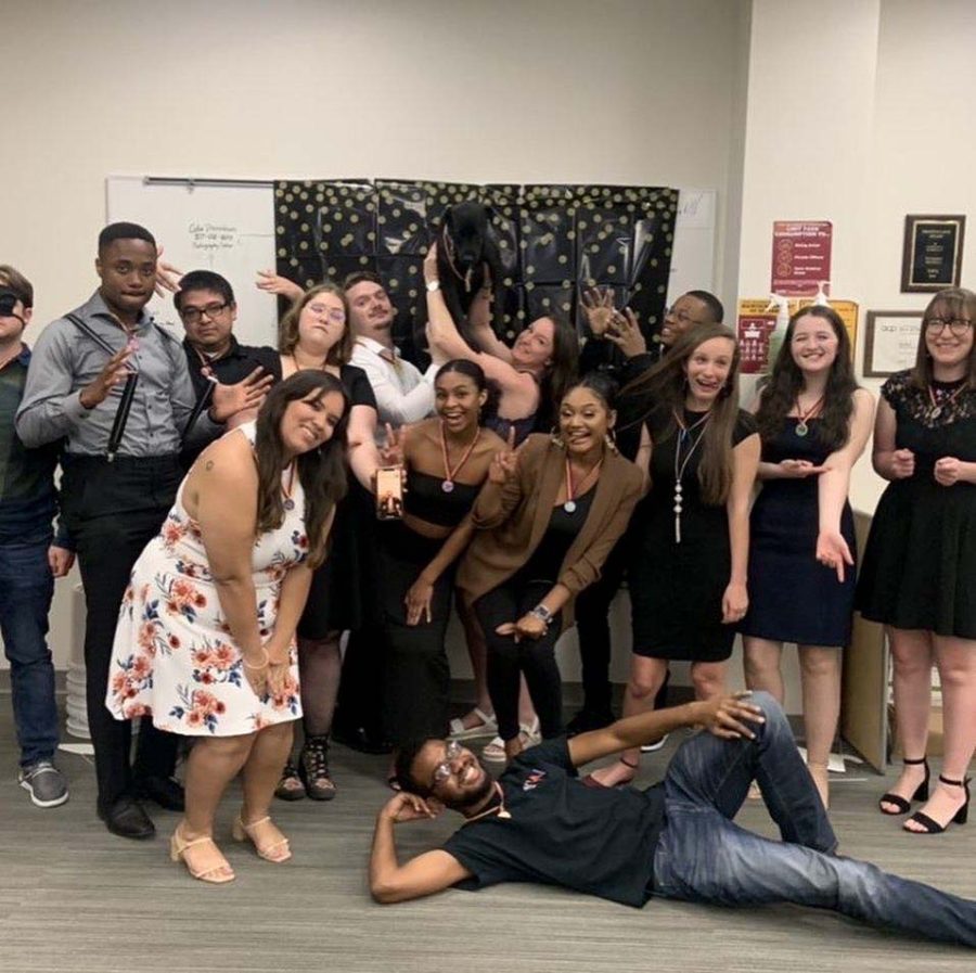 Amos Perkins poses with Wichitan staff at the spring 2021 end-of-semester party, April 9, 2021. Photo courtesy of Emma Perkins.