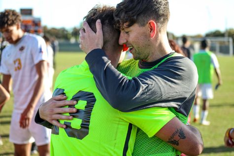 Marketing senior and goalkeeper Marc-Antoine Huzen hugs sport and leisure studies senior, defender and teammate Rory O'Keeffe in celebration after the Stangs' victory against Lubbock Christian and in the Lone Star Conference Postseason Tournament.