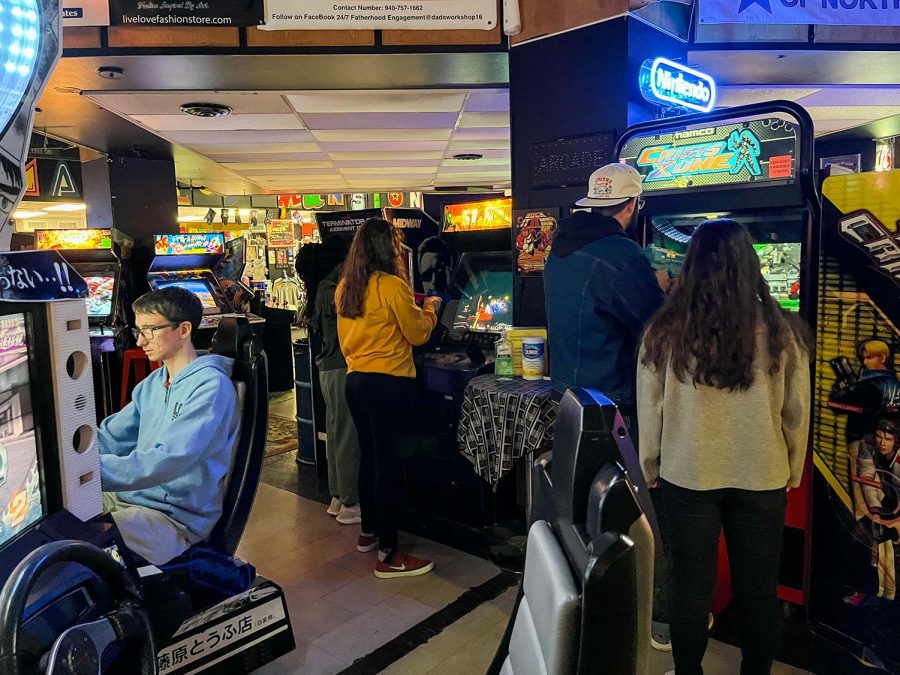 MSU students play various games at Maniac's Mansion, such as Crisis Zone, Jan. 11.