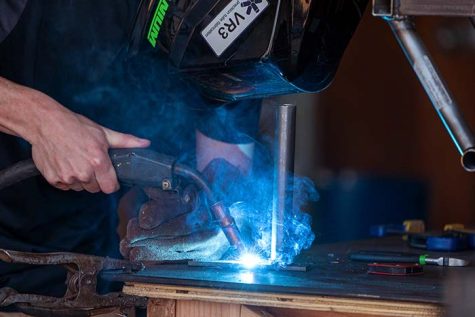 Mechanical engineering senior and head of suspension Trevor Snyder works with a blowtorch, Feb. 1.