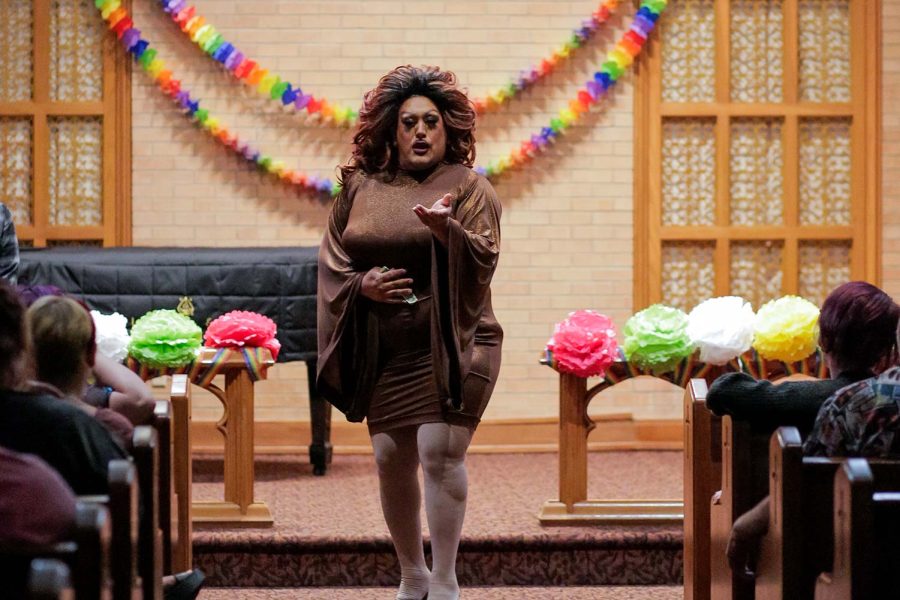 Genevieve Addams walks down betwen the pews during her performance, April 8.