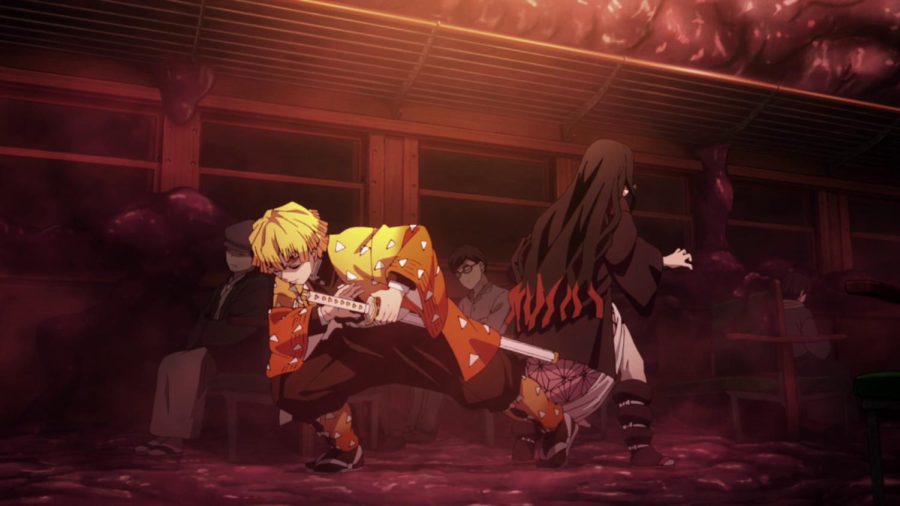 Zenitsu y Nezuko luchando contra demonios en el tren Mugen.