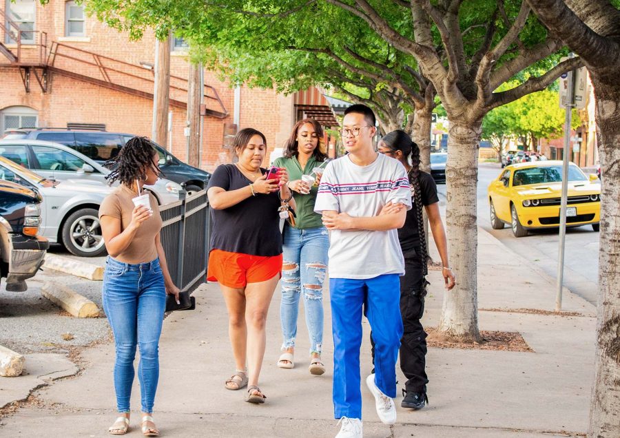 Students socialize as they explore Wichita Falls downtown are, April 26.