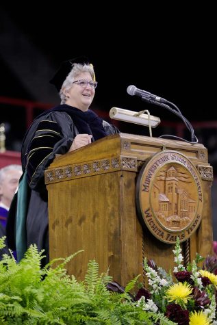 General Dawn Farrell addresses the graduating students before they receive their degrees, saying that while their dreams are important, don't pass up opportunities that may diverge away.