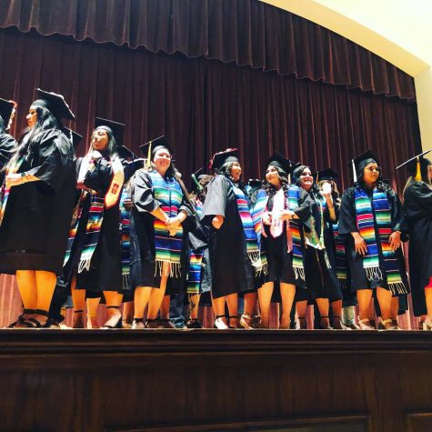 Latino graduates fill the stage during the ceremony, April 30.