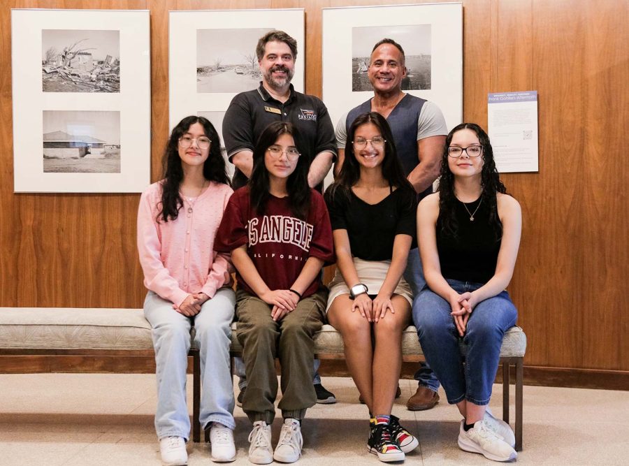 Wichita Falls High School students América Benitez, Natalie Perez, Andrea Granados and Natalie Rodriguez stand with WFMA curator Danny Bills and Café con Leche founder Gonzalo Robles at WFMA, Sept. 17. The group worked together to create the Finding Your Voice gallery.