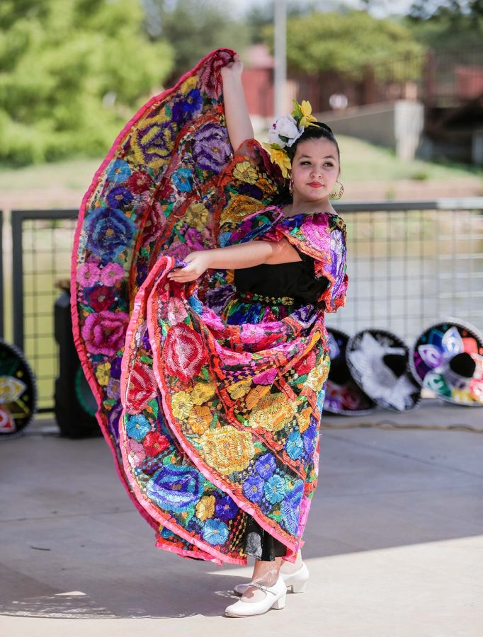 Zavala International Dance member Ramona Schwartz finishes a dance from Chiapas, Mexico with a flourish, Sept. 17.