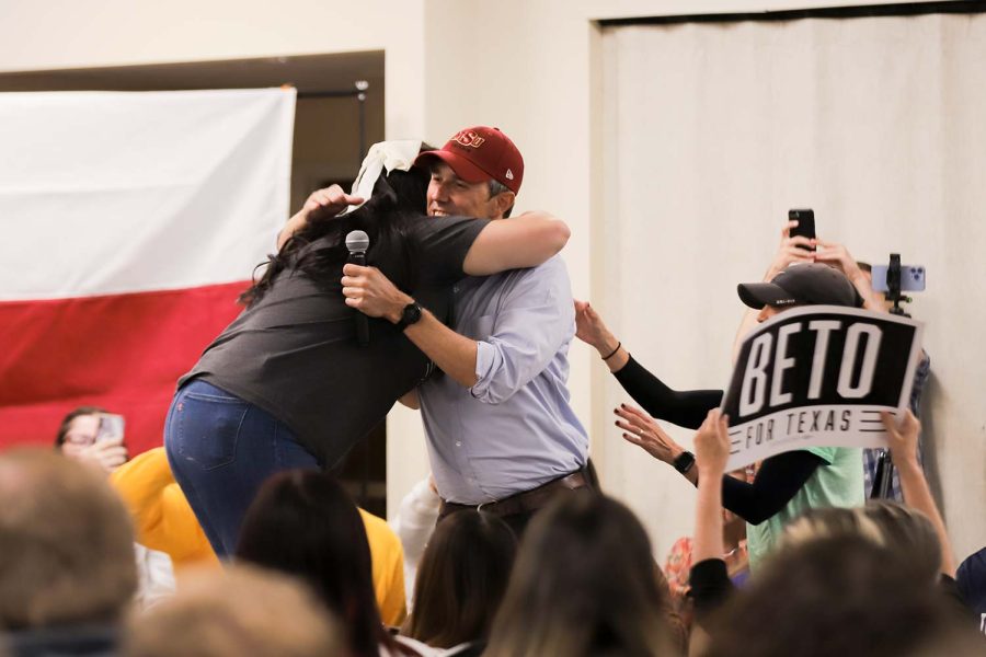 MSU Democrats president Cristin Martin hugs Texas gubernatorial candidate Beto ORourke as he comes on stage, Oct. 20.