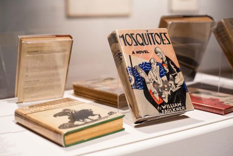 Books from Giles' personal collection sit on display to complement the exhibition, Oct. 20.