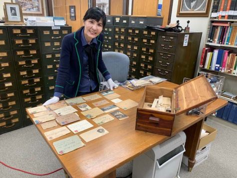 German professor Kyung Lee Gagum examines documents found in the wooden box, 2022. Photo courtesy of Wichita County Archives.