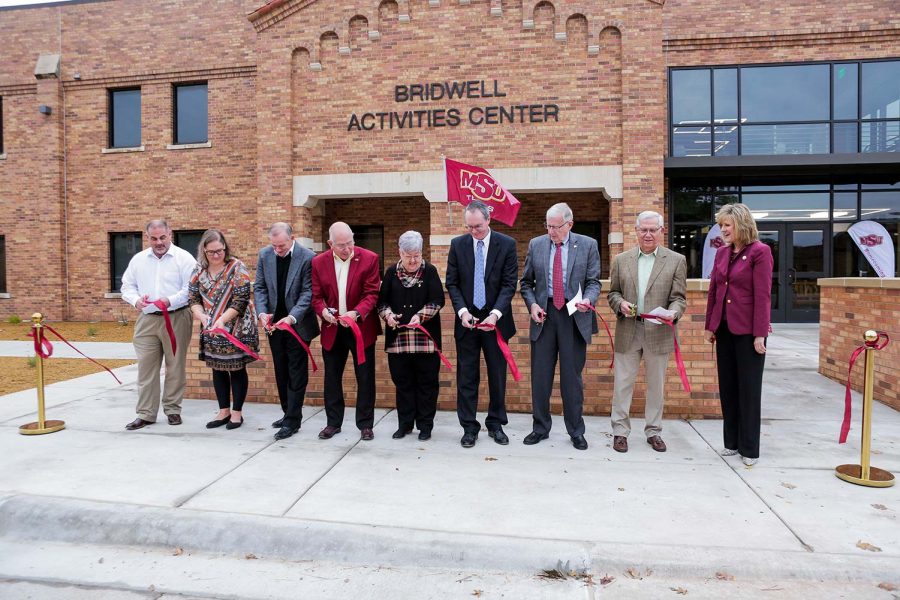 Donors+and+head+MSU+staff+cut+the+ribbon+to+signify+the+opening+of+the+Bridwell+Activities+Center%2C+Oct.+28.
