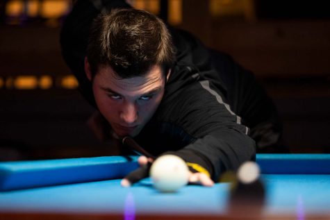 Sport and leisure senior Michael French prepares to take a shot, Nov. 30. French has been playing pool competitively since his second day on campus.