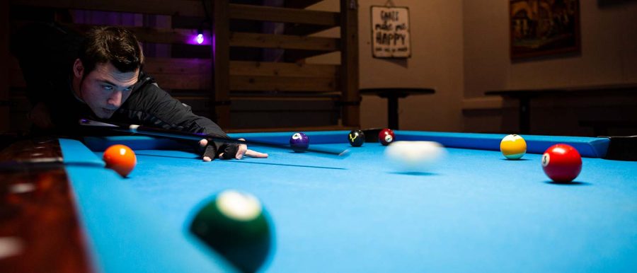 Sport and leisure senior Michael French plays billiards regularly to stay sharp, Nov. 30. While he doesn’t have any real challengers on campus, he keeps an eye out for students who are interested in the game.