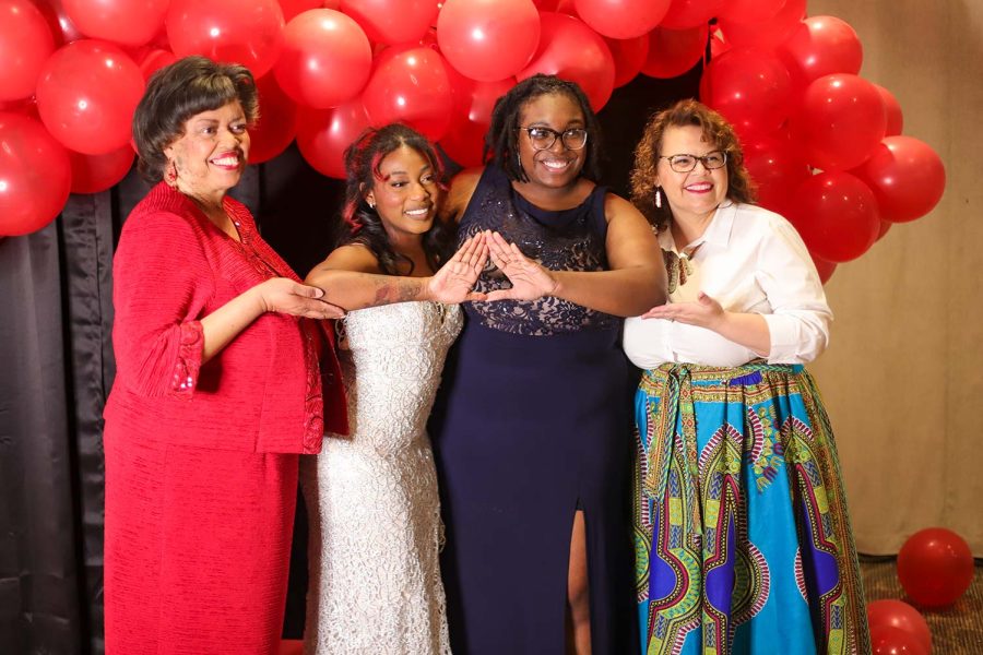Alumni of the Sigma Theta chapter of Delta Sigma Theta pose together for a group photo before the gala, Feb. 17.
