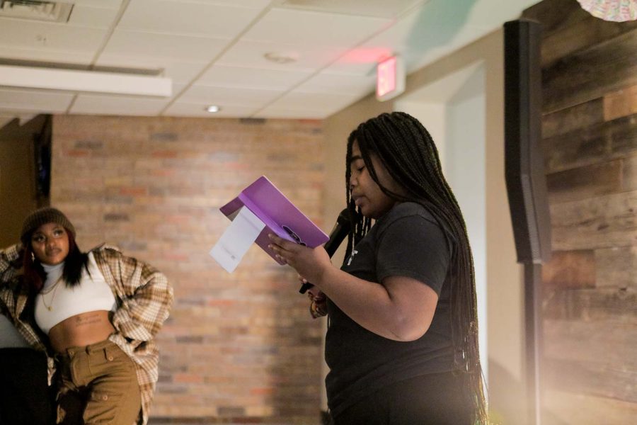 Social work and music sophomore Janae Law reads the poem Black People Magic, Feb. 3.