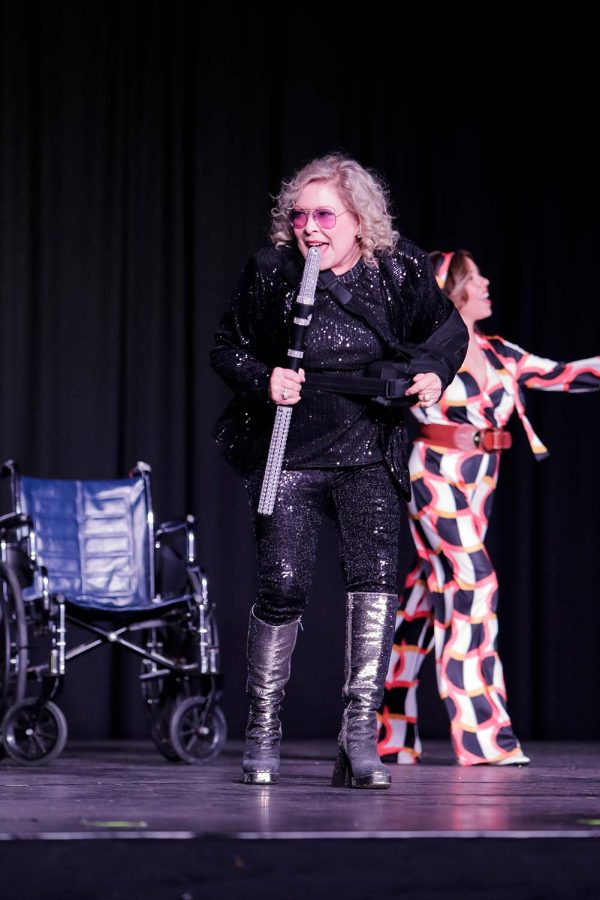 Meals on Wheels board president Lee Ann Haines continues to perform after taking a brief tumble during her performance, Feb. 17. Haines went on to win the Mirror Ball award for raising the most money at the gala.