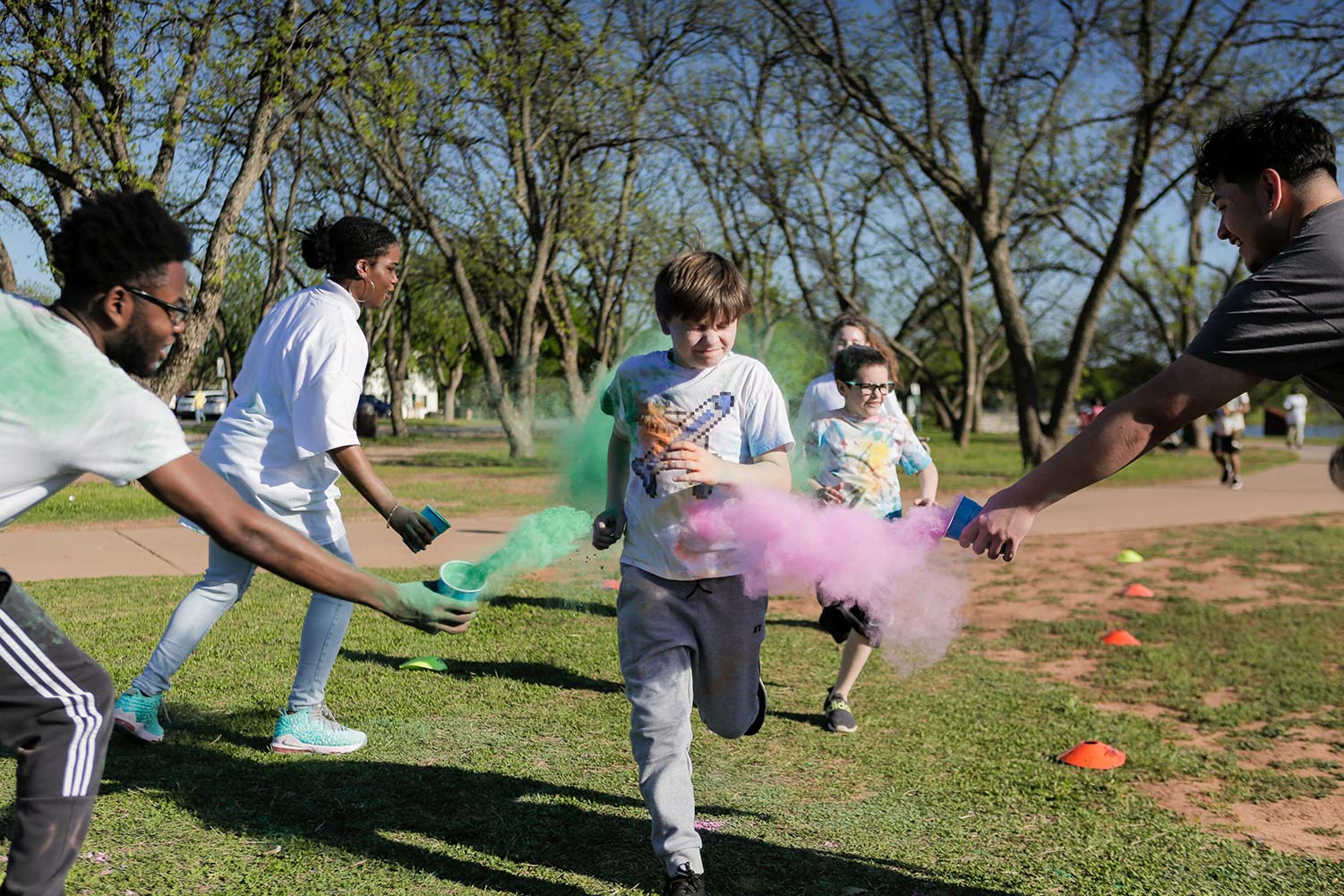 Some children prepare to be covered in dust as they pass a checkpoint, April 12. The "5Kolor Run" had open registration, which let a wide variety of runners participate.