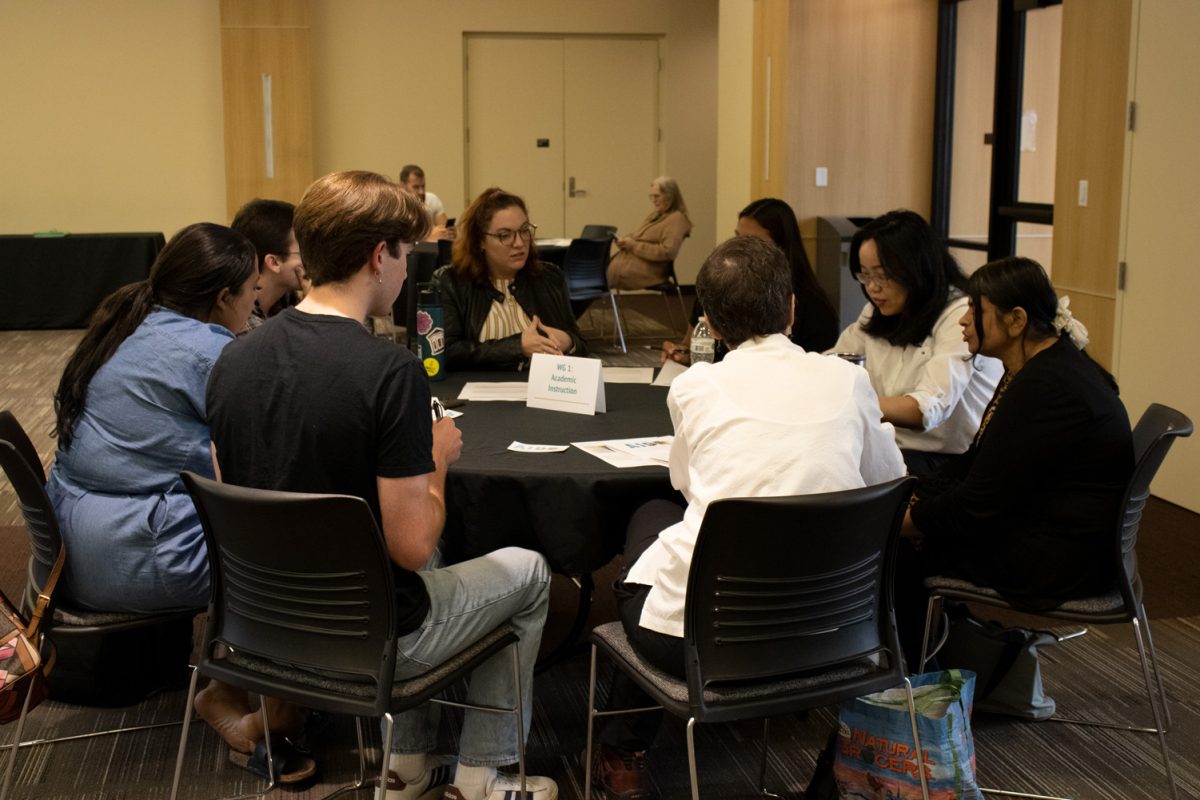 Professors and students gather around to discuss new ways to work with the recent legislation, Sep. 12.