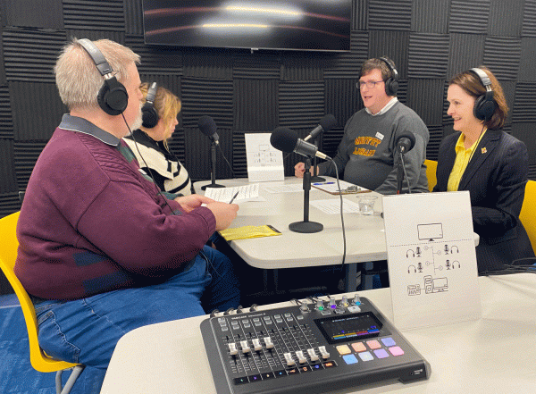 From left to right Ryan Samuelson, Librarian Associate University, Allison Atherton, Library Marketing and Outreach Coordinator, Joseph McNeely, Librarian Instruction, and President Haynie record the inaugural podcast of the Moffett Library studio, Jan. 25.
