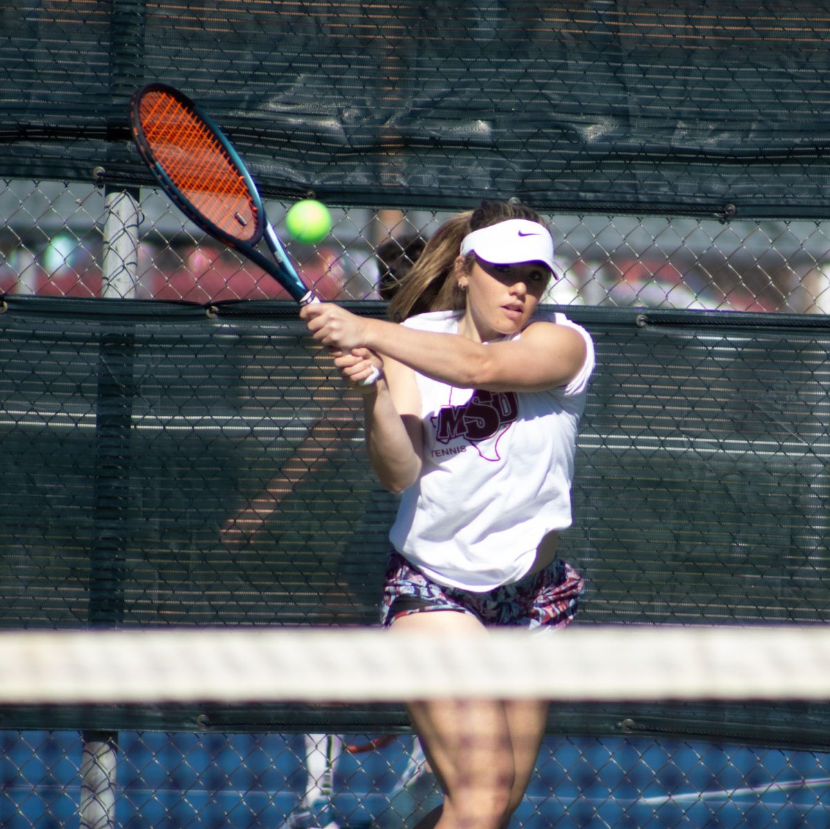 Sydney Williams, winds up for a hit during practice, Feb. 3. The tennis season will begin on Feb. 8.