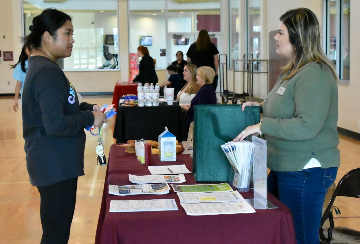Lalawin Lay, marketing junior, learns about nutrition at the Wellness Fair, Feb. 7.