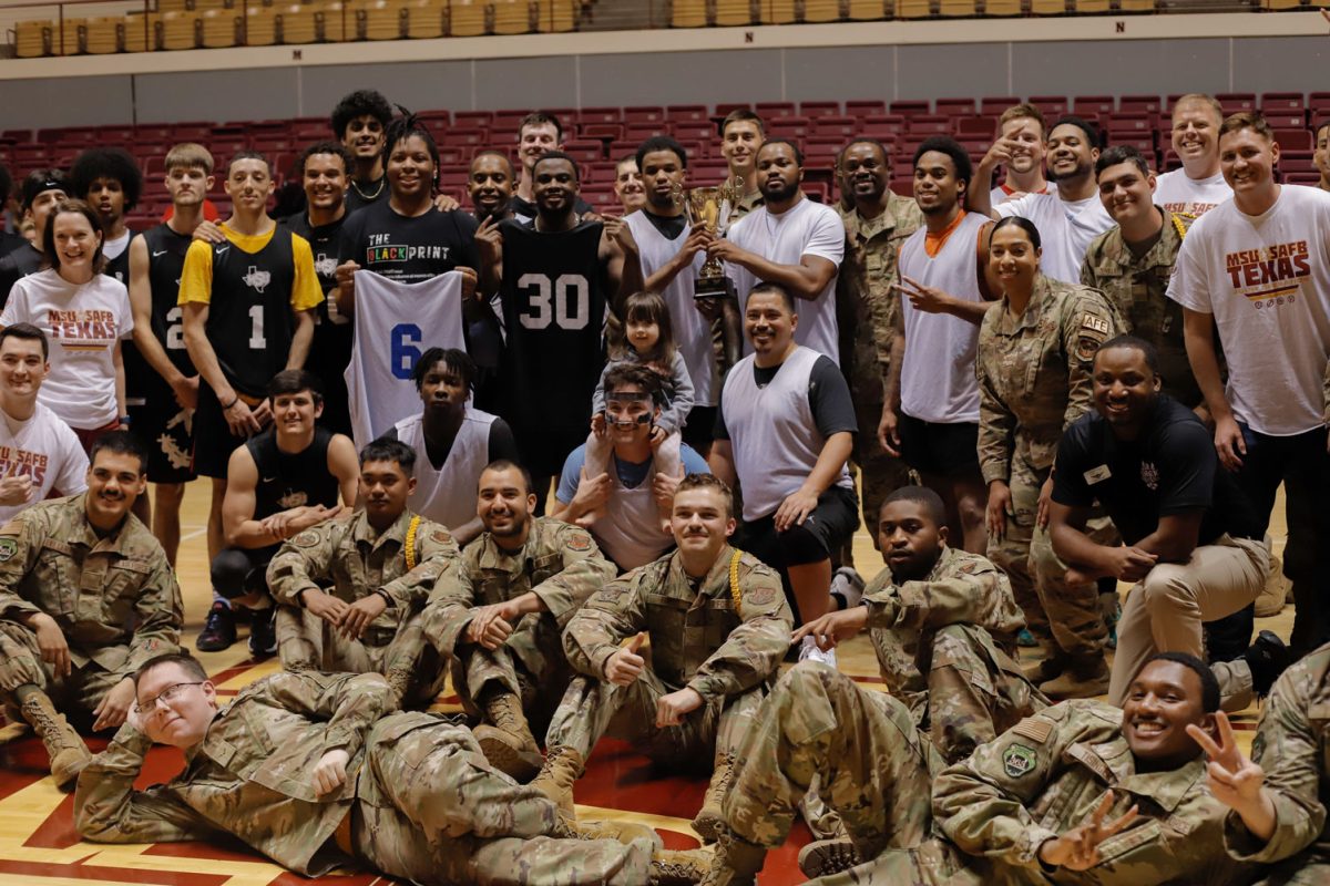 Sheppard Airmen and the MSU intramural rec basketball team pose for a picture, March 22.