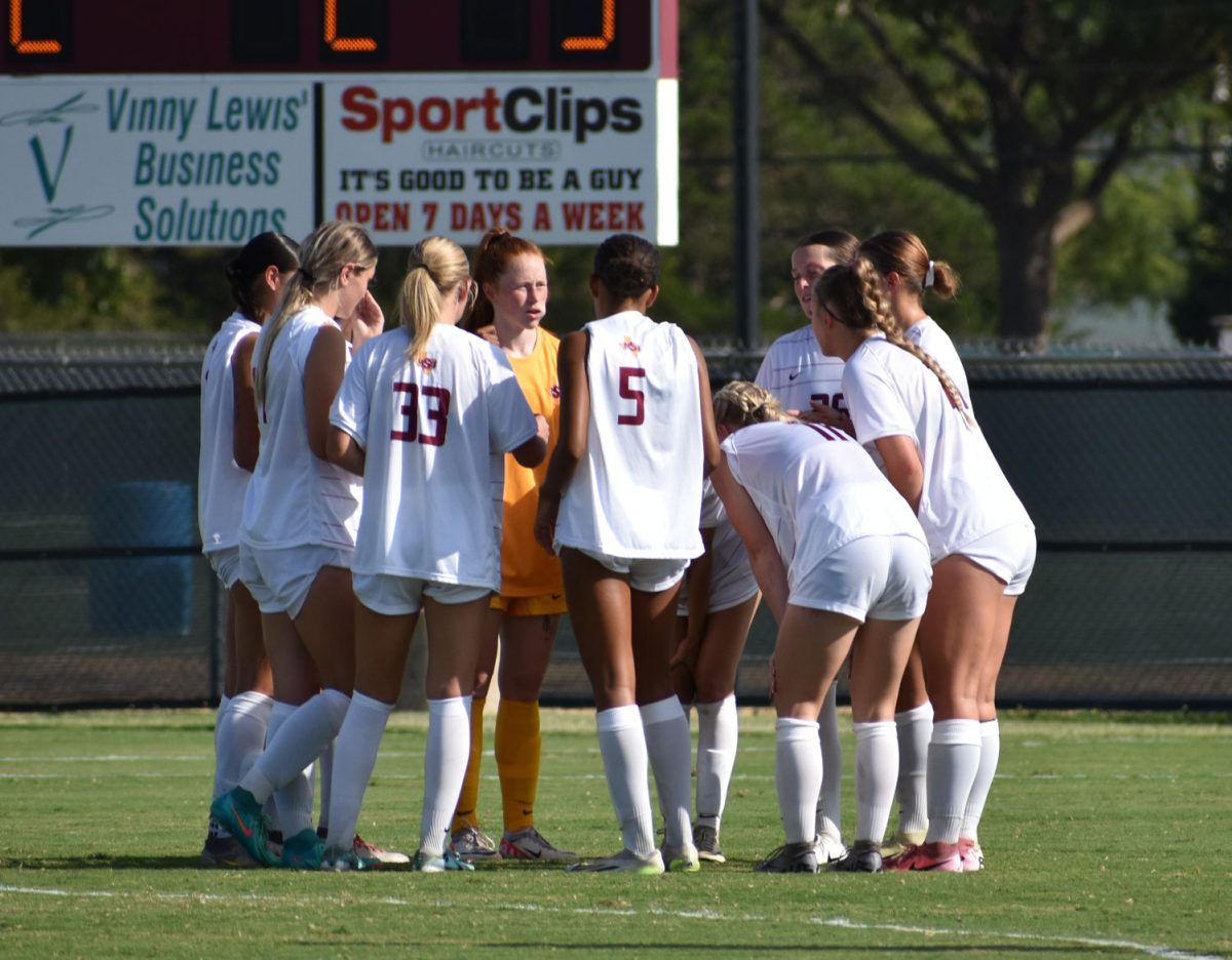 MSU women's soccer team huddle together before starting the second half of its game against Western Colarado, Sept. 5.