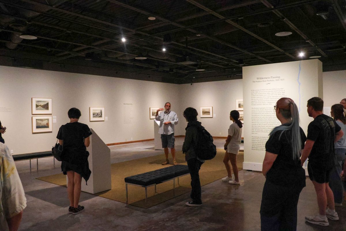 Professor Todd Giles explains the importance of Hudson River Portfolio to a group of arts and literature society students, Sept. 27.