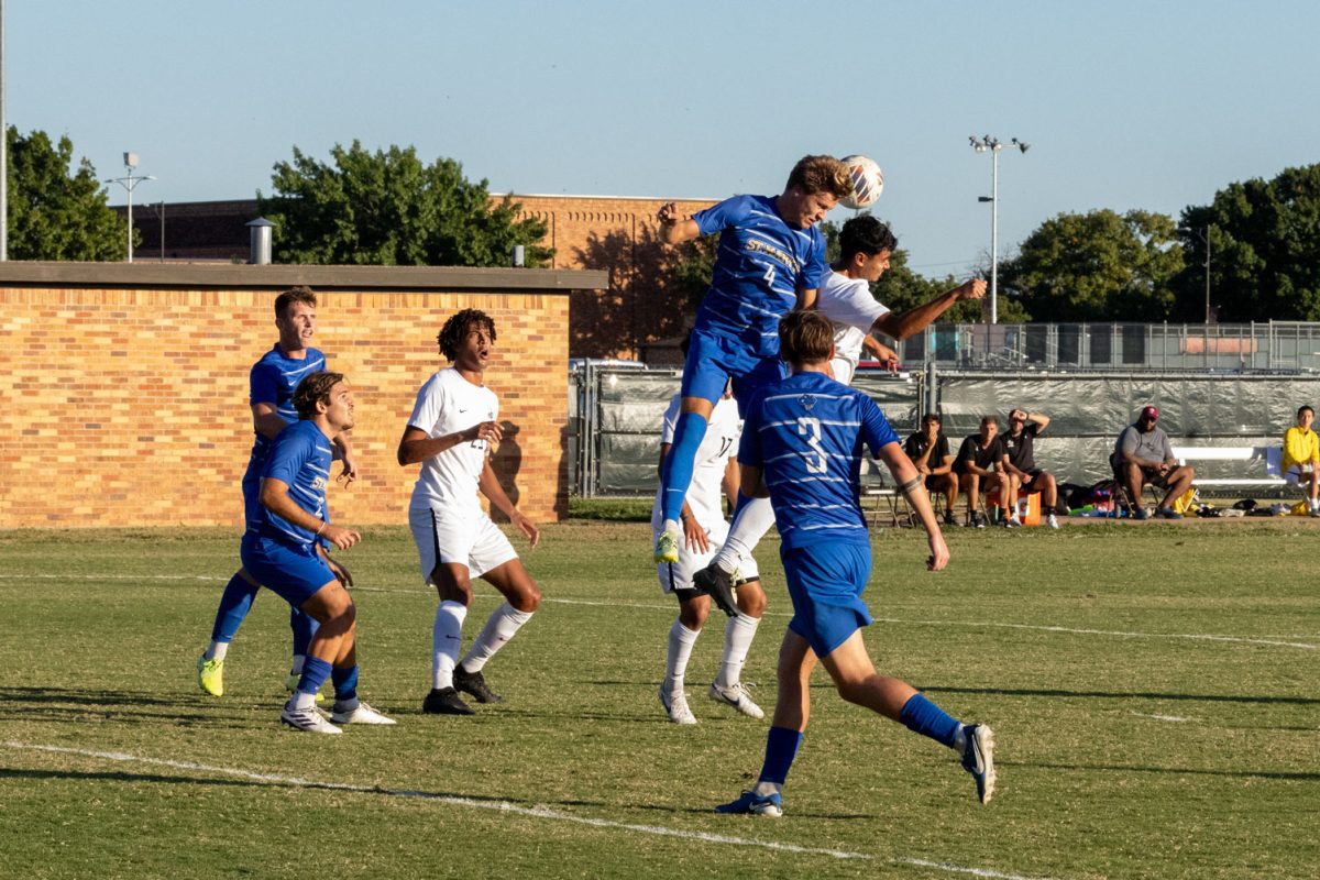 Jecsi Orellana-Espinal (8) jumps to head the ball away from the Rattler player, Nov. 6.