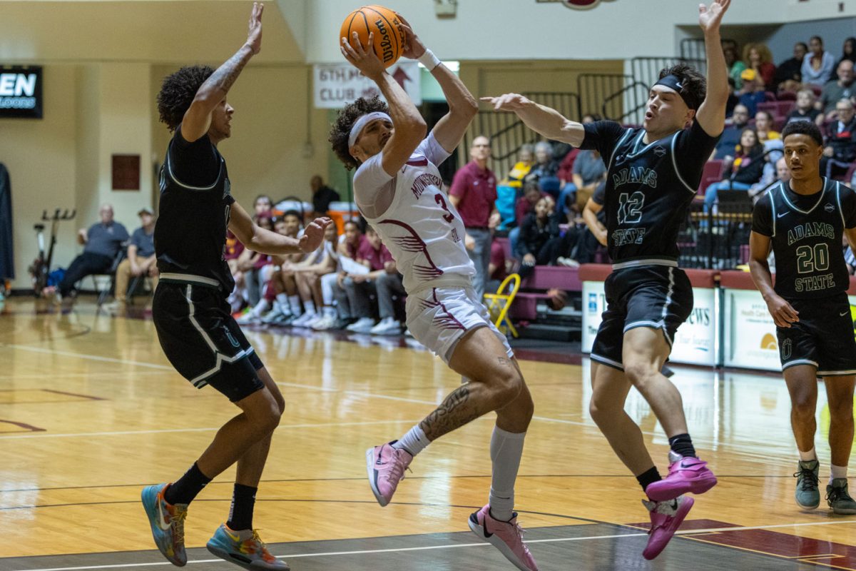 Mason Gibson (3) goes up for two while opposing team tries to block his shot, Nov. 16.