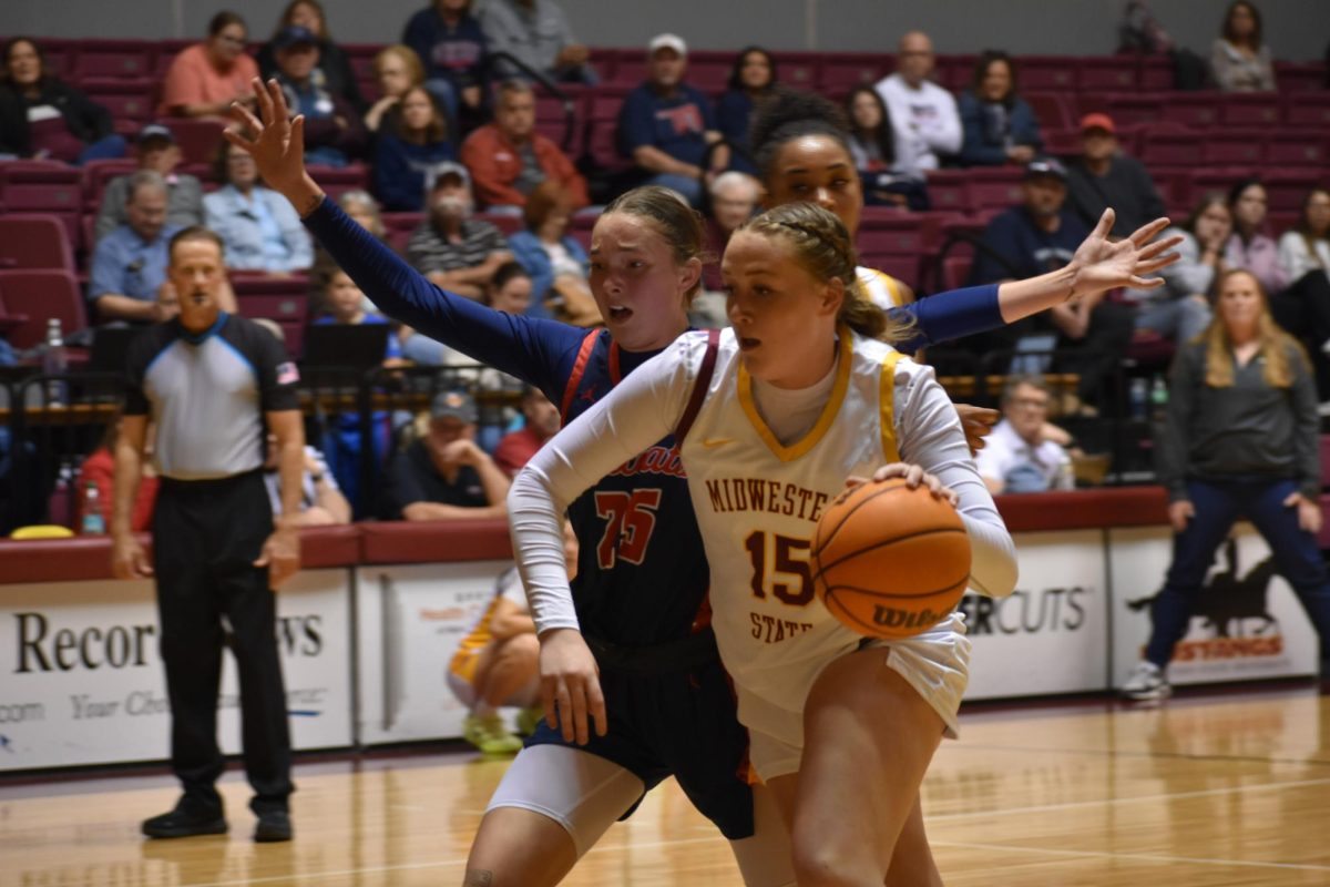 Kerbie Cash (15) drives to the basket  to shoot a layup  against the Rogers State Hillcats, Nov. 15.